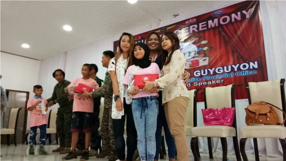 During the moving up ceremony where Kaye Koo of SinagTala Foundation helped in disseminating the Nutri10Plus and DayCee vitamin pouches to the kids